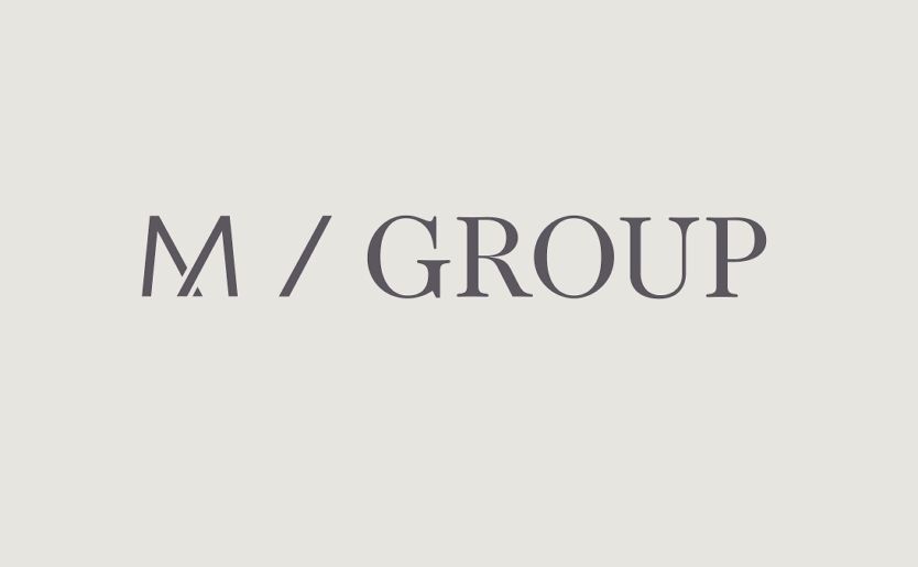 M/Group 2016 logo grey on light grey background