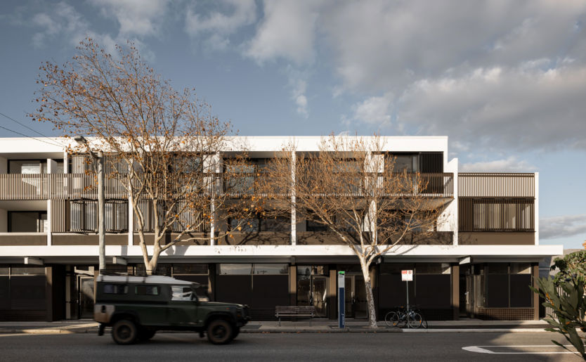 South Terrace profile of M/28 Apartments by Match in South Fremantle with an old school 4WD driving by