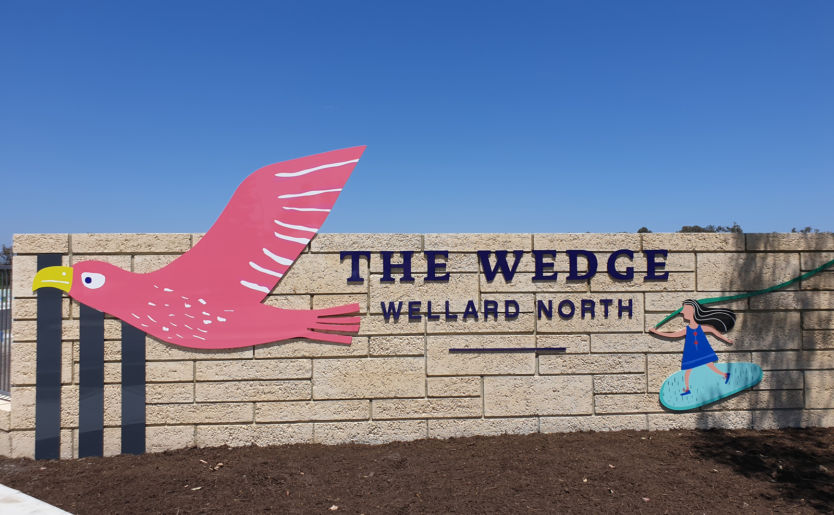 Front entrance wall of The Wedge in Wellard North with the branding mascot eagle and little girl decal